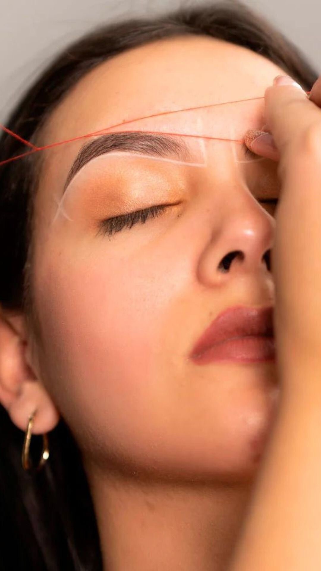 Close up of eyebrow threading being performed at Brow & Lash Queen, Hampton